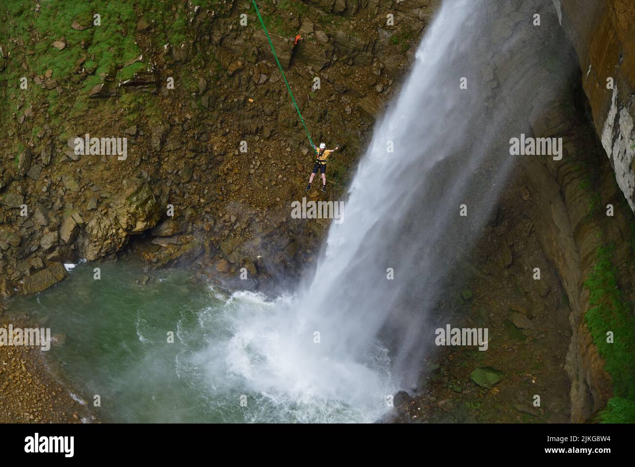 Dagestan, Russia - 21 July, 2022: Jumper shown after a successful jump to the waterfall. Hunzah. Tobot Waterfall. Canyon Of Khunzakh, Caucasus mountai Stock Photo