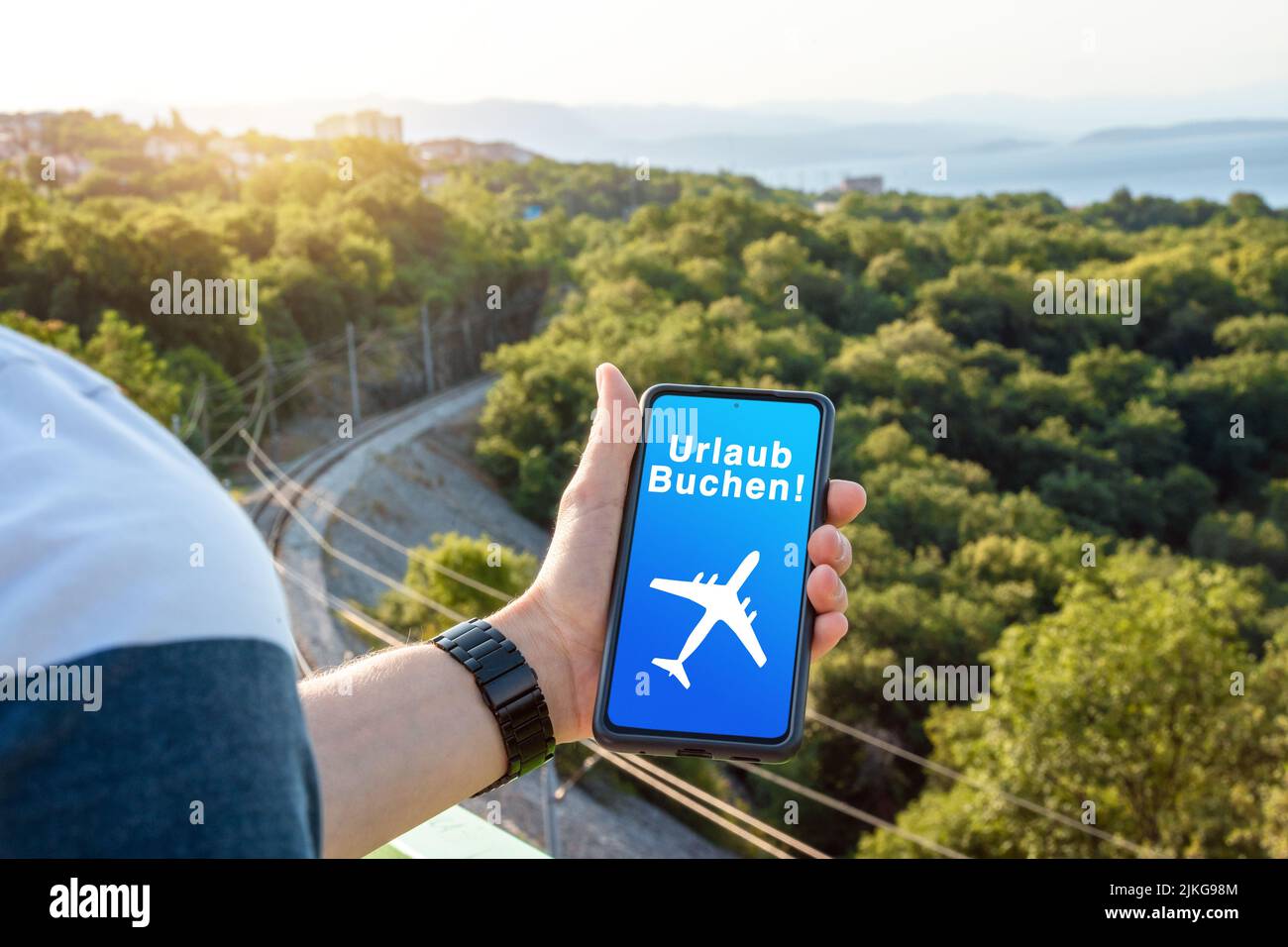 30 July 2022: Man Use Smartphone For Planning And Booking A Trip. Smartphone Screen With Inscription, Booking Vacation, Trip And Vacation Concept PHOT Stock Photo