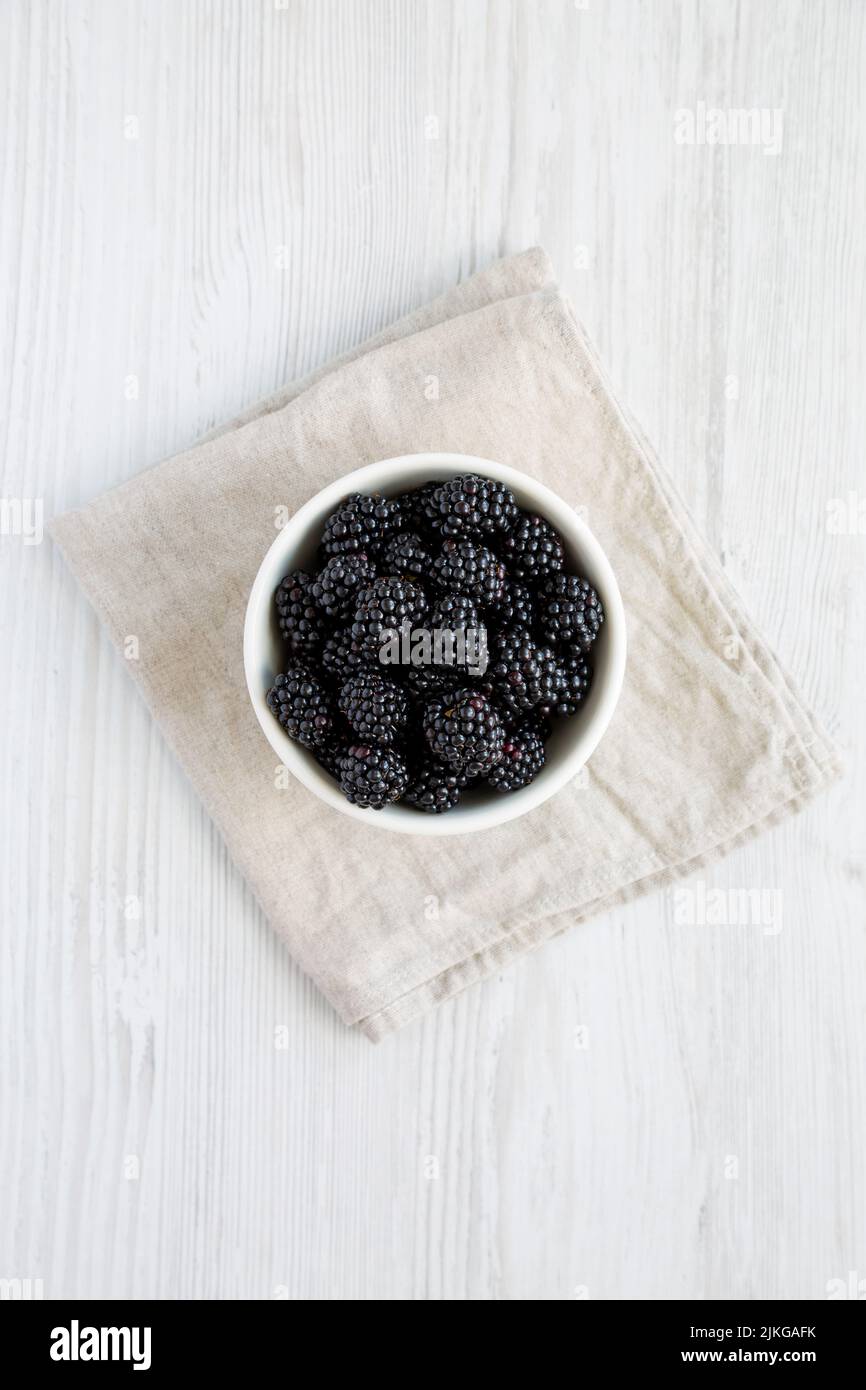 Raw Blackberries in a Bowl, top view. Flat lay, overhead, from above. Stock Photo