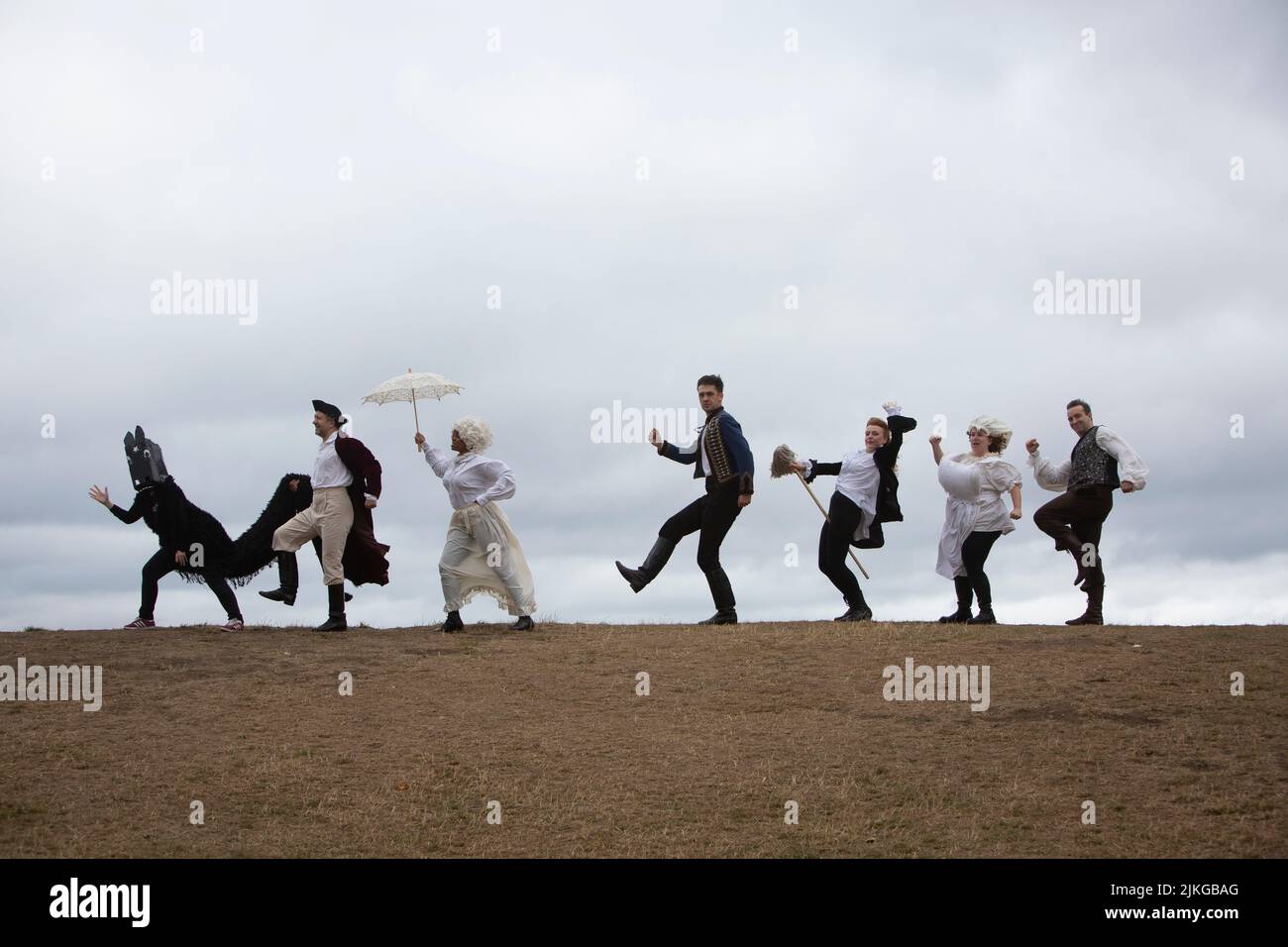 Edinburgh. Scotland. UK. 2nd August 2022. Photocall: Literary closing and slapstick on Calton Hill. The Fringe the six actors from the brilliantly fast paced slapstick romp Classic! (daily 3- 29 August Pleasance 1) will wear a smorgasbord of 17th, 18th, and 19th century costumes (think wigs, parasols, long velvet, military jackets and jolly jack tars). With props including trumpets, parasols, a pantomime horse, very unperiod water pistols and a bright pink melodica). They will be clowning and posing with the city behind them and on The National Monument of Scotland. Pic: Pako Mera/Alamy Li Stock Photo