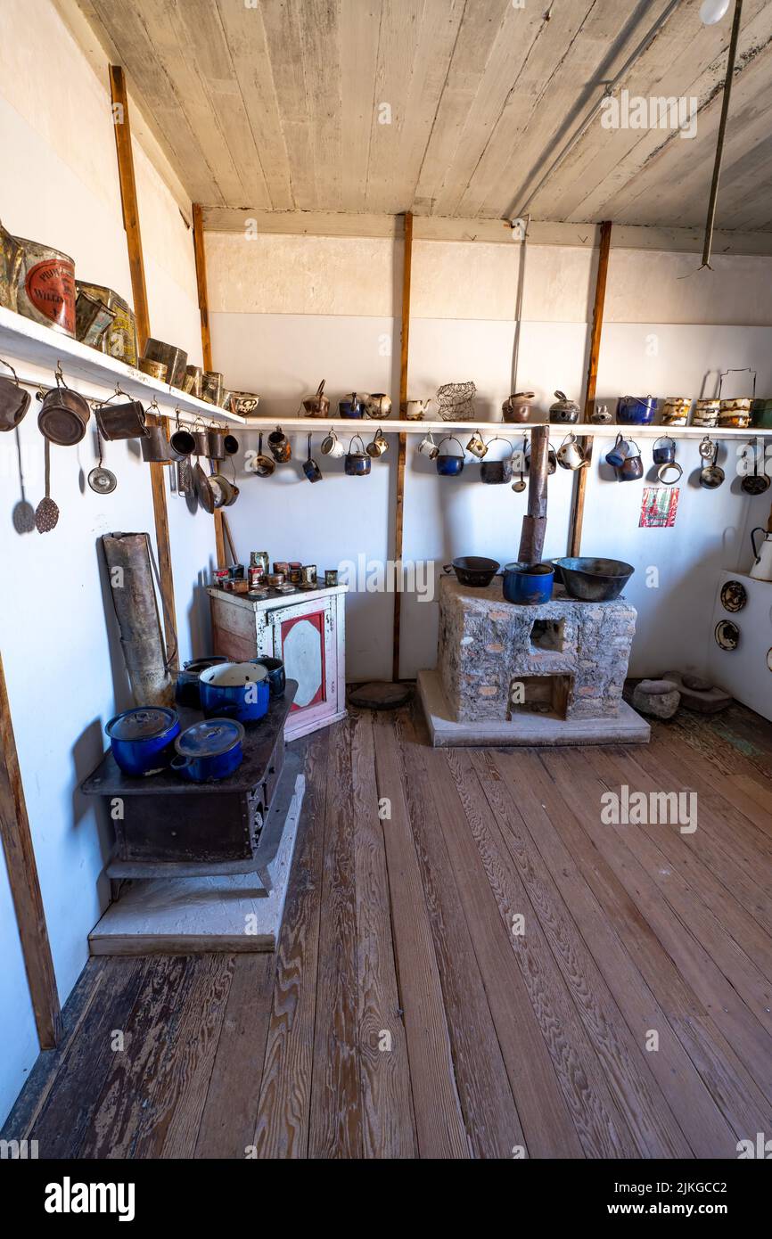 Display of kitchenware from the former saltpeter company town of Humberstone, Chile.  Now a ghost town and museum. Stock Photo