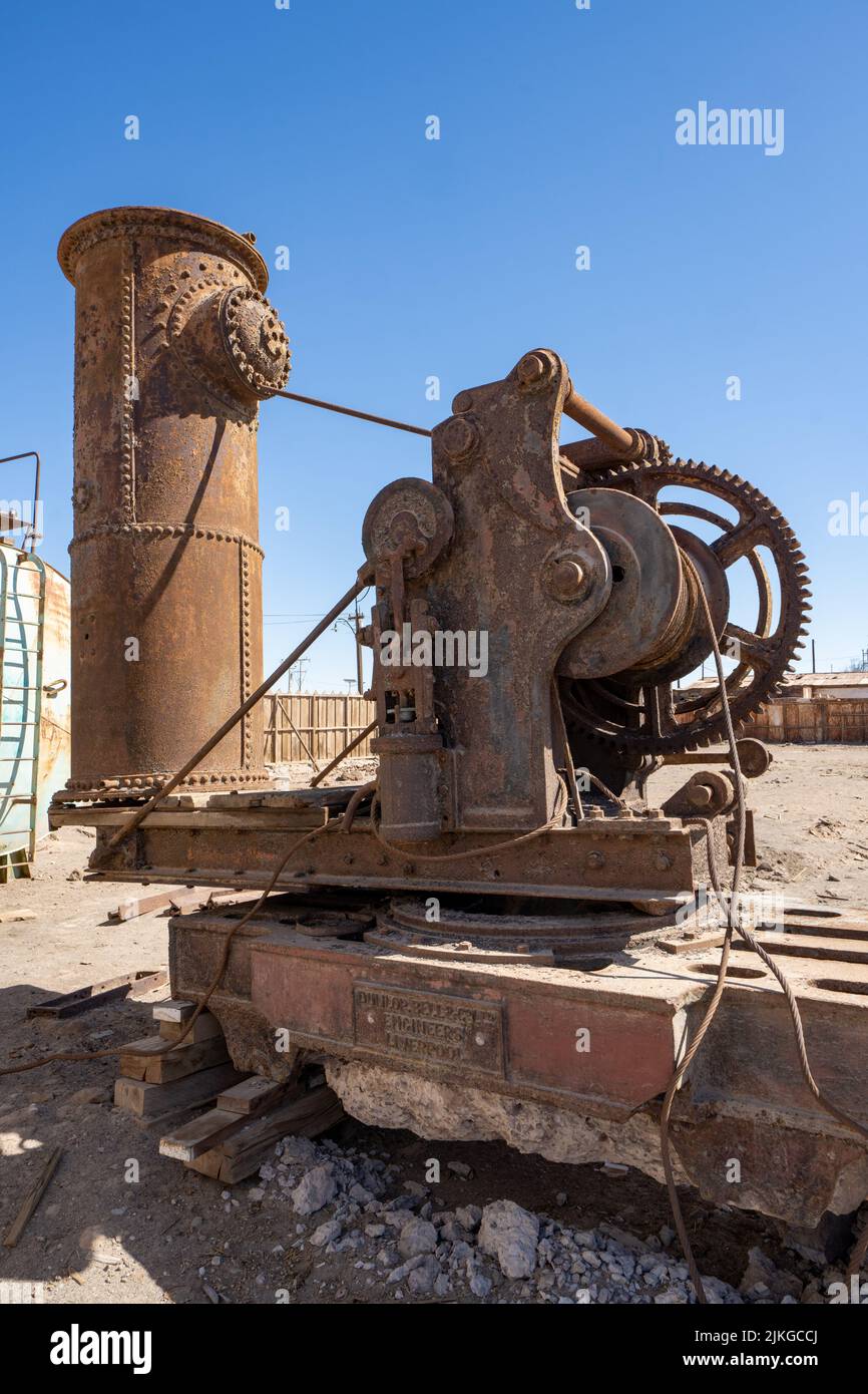 Outdoor museum display of old machinery used in the saltpeter works in Humberstone, Chile. Stock Photo