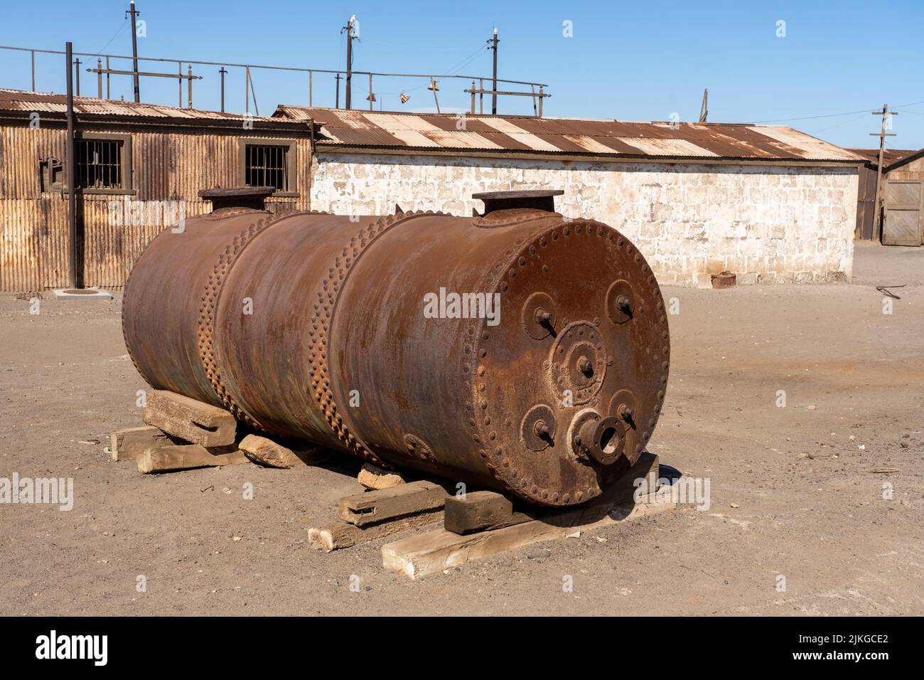 Outdoor museum display of an old steam boiler used in the saltpeter works in Humberstone, Chile. Stock Photo