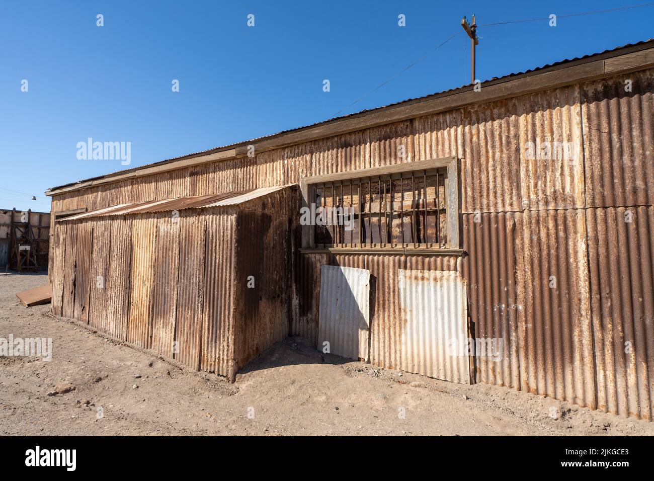 A rusty old workshop building in the outdoor museum of the saltpeter works at Humberstone, Chile. Stock Photo