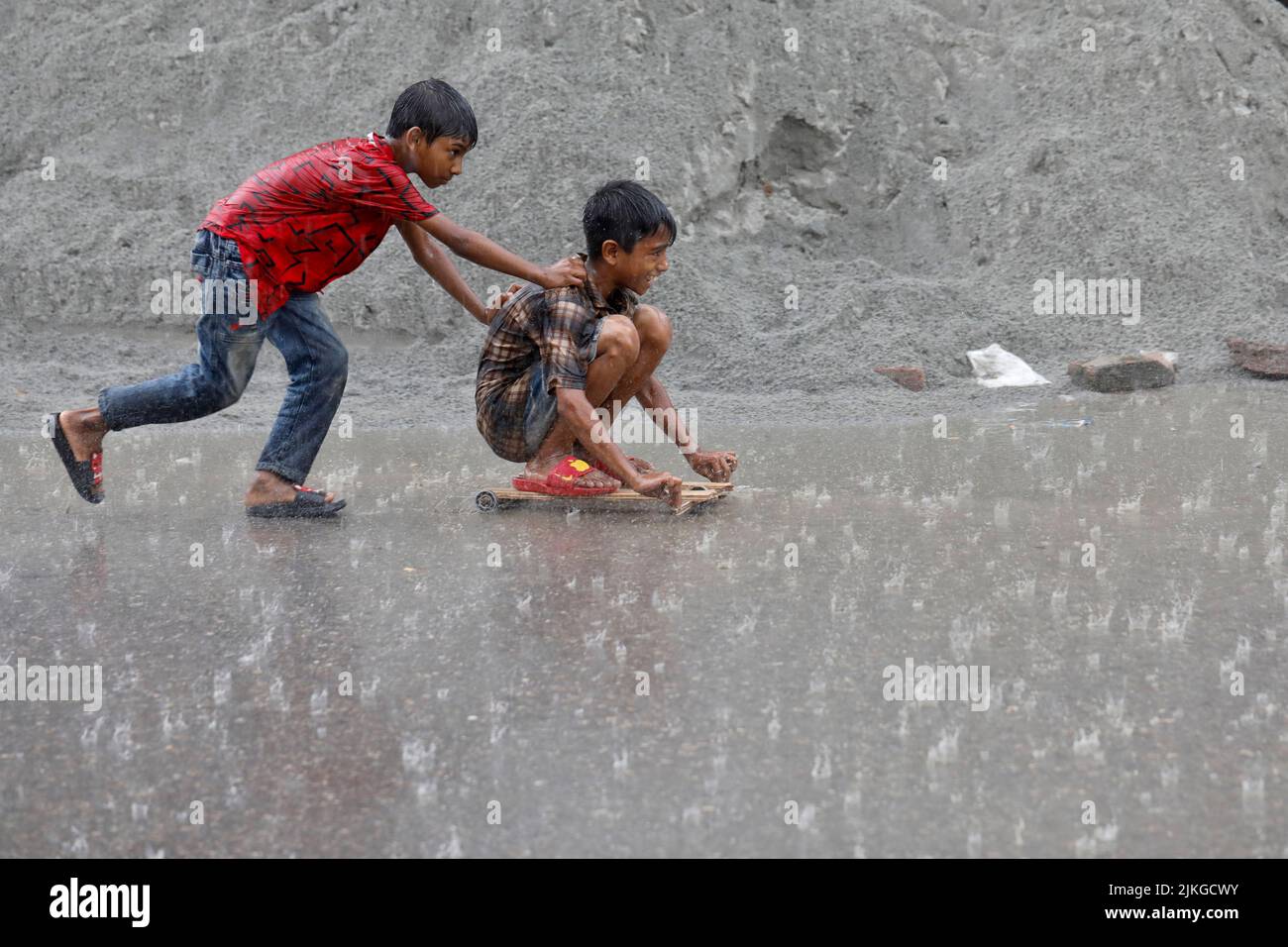 Dhaka, Bangladesh - August 02, 2022: People walk through the Mugda para ...