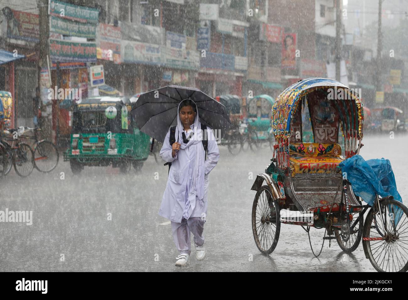 Dhaka, Bangladesh - August 02, 2022: People walk through the Mugda para ...