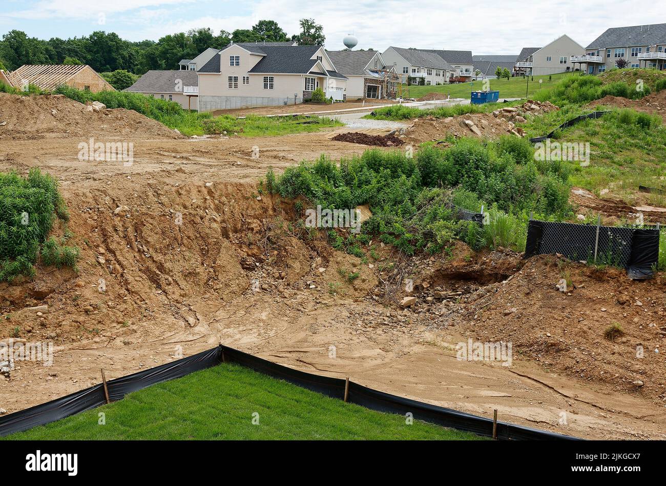 new house construction, varied stages, streets, dirt, completed homes