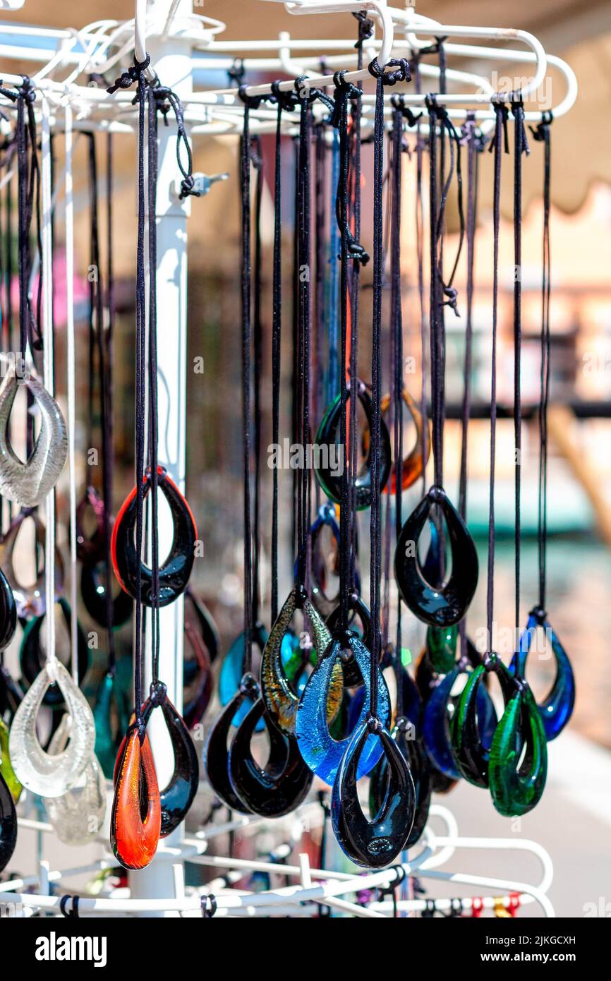 glass jewelery on display at a street vendor Stock Photo