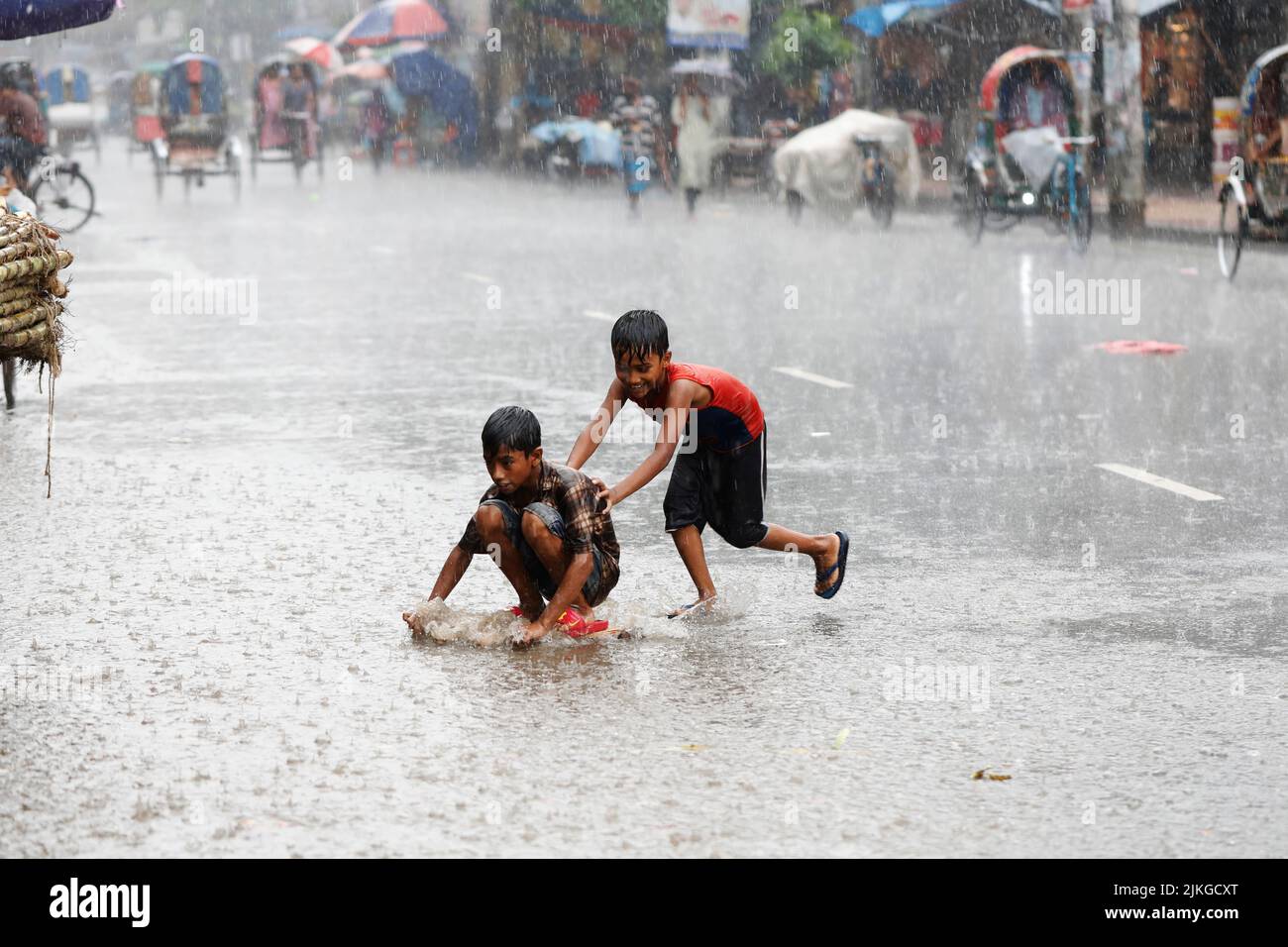 Dhaka, Bangladesh - August 02, 2022: People walk through the Mugda para ...
