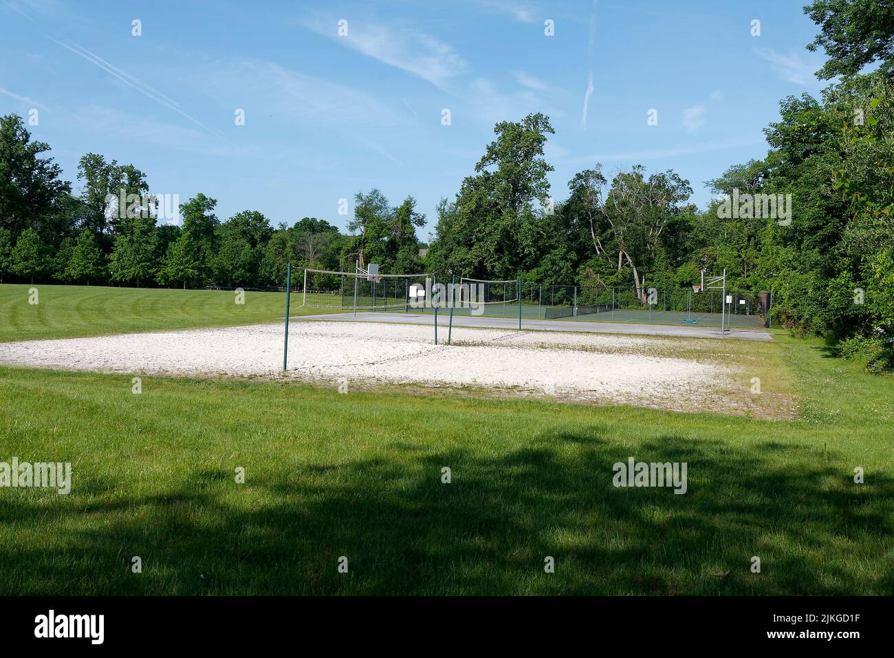 volley ball courts, tennis courts, waiting for people, recreation, sport, fun, exercise, grassy fields surrounding, trees, summer Stock Photo