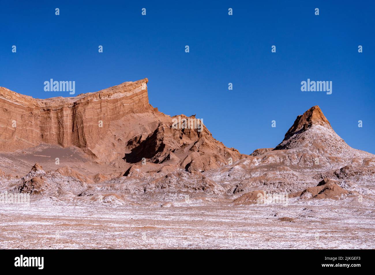 Salt deposits and siltstone rock formations in the Valley of the Moon or Valle de Luna near San Pedro de Atacama, Chile. Stock Photo