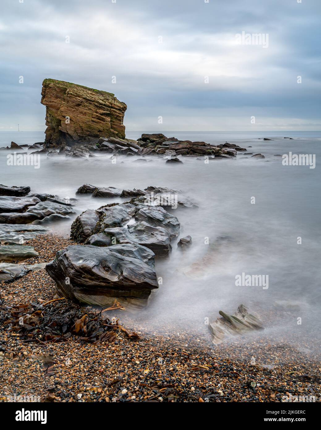 A vertical shot of the cliffs and sea. Collywell Bay, UK. Stock Photo
