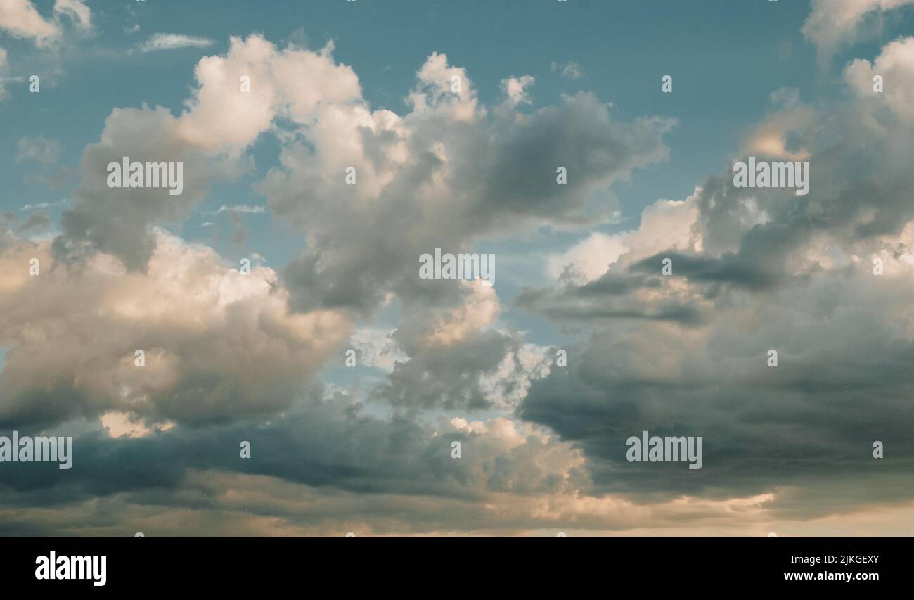 Clouds at sunset, summer sky background, evening cloudscape Stock Photo