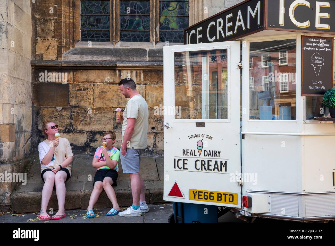 Eating icecream during the heatwave, York.  Summer Heatwave in York. A new UK record temperature, of 40.3C was set during the day in Lincolnshire . York,  2022, UK. Stock Photo
