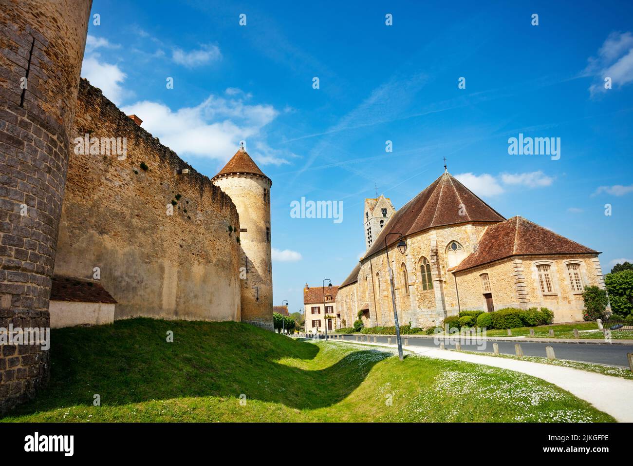 Saint-Maurice church and walls of Blandy castle in France Stock Photo