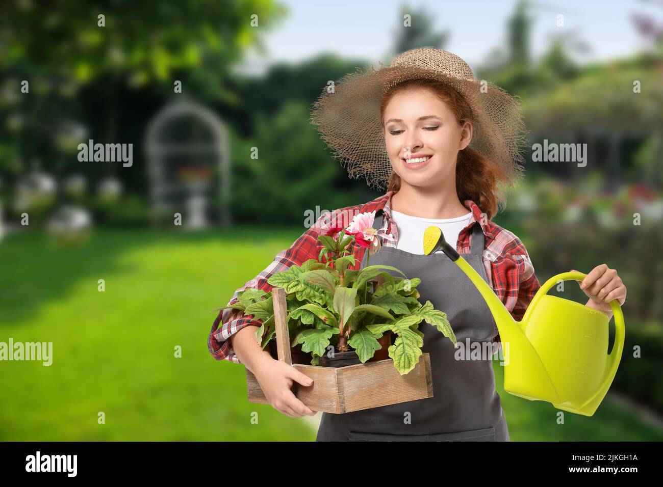 Portrait of female gardener outdoors Stock Photo - Alamy