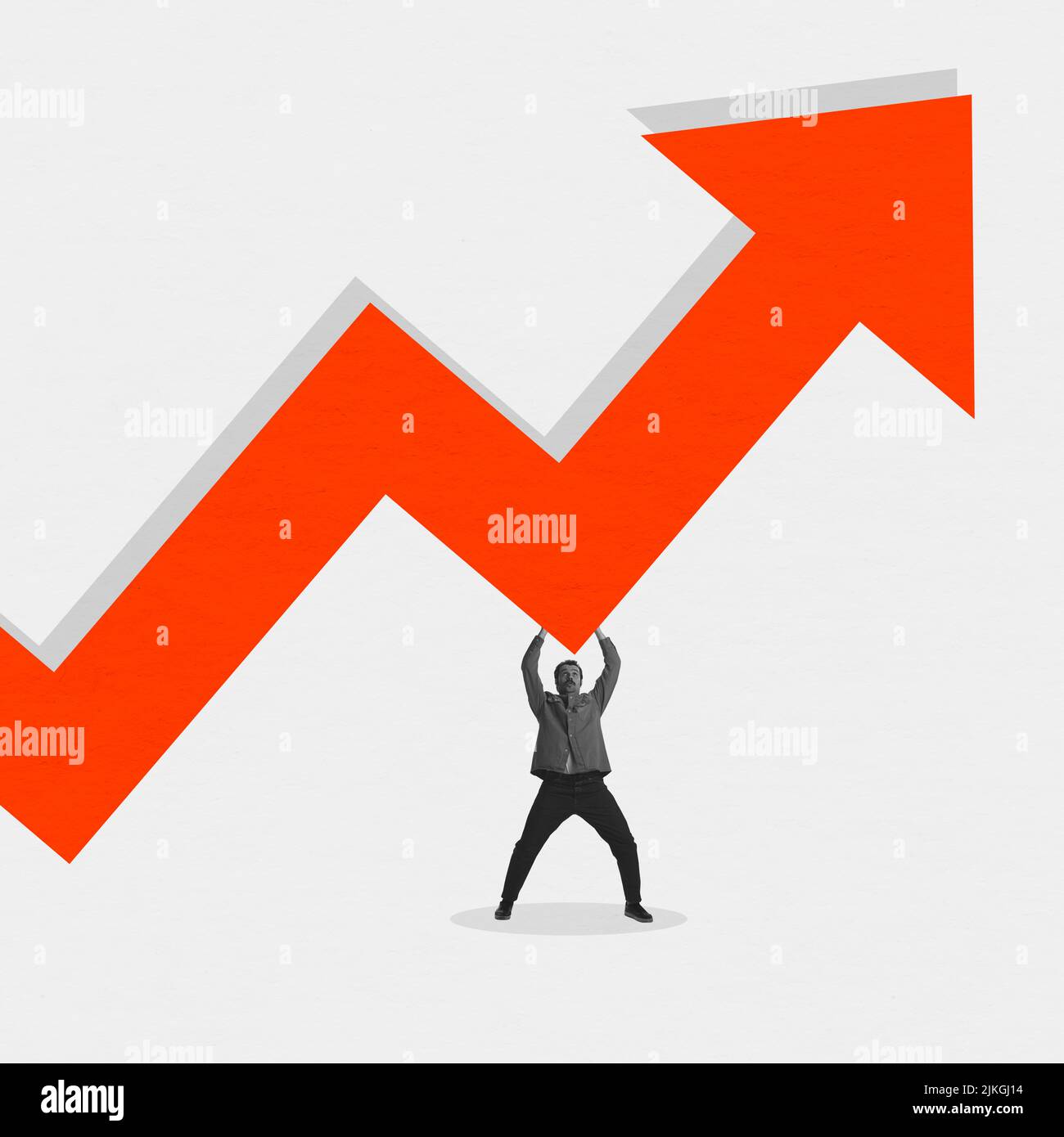 Young man holding huge orange arrow as indicator of increase in prices for goods, products and services. Concept of business, analytics, finance Stock Photo