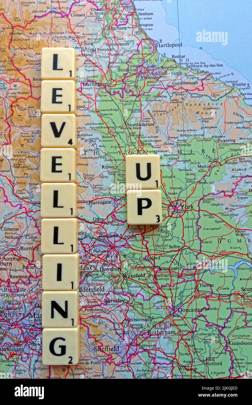 Levelling Up, Tory slogan,spelled out in Scrabble letters on a map Stock Photo