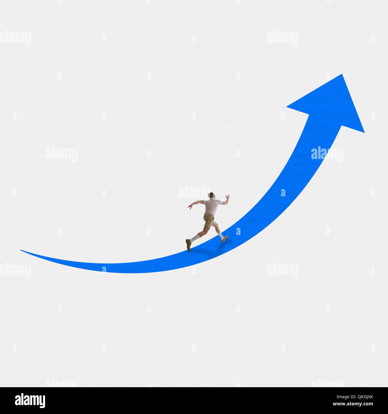 Young man running forward towards his goal along the blue arrow over white background. Concept of business, art, psychology of success Stock Photo