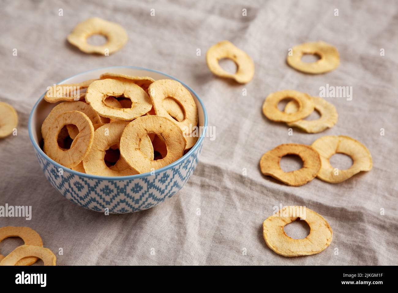 Homemade apple chips in a bowl, low angle view. Stock Photo