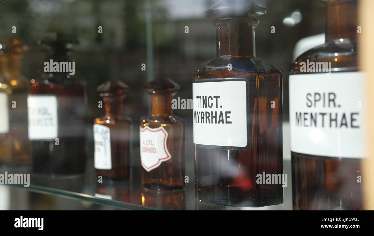 A selective focus shot of vintage pharmacy bottles on display Stock Photo