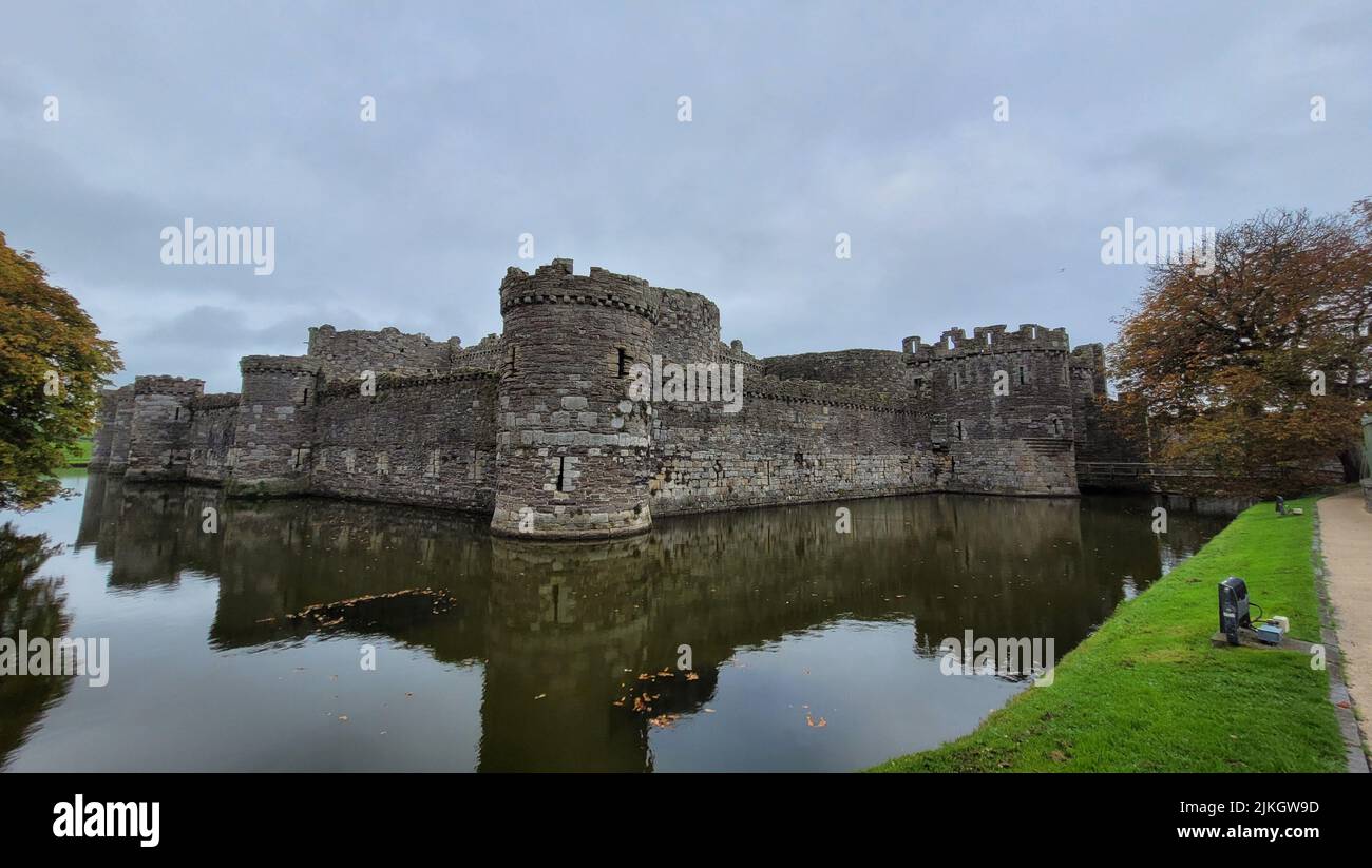 A panoramic view of the ancient Beaumaris Castle with reflection in ...