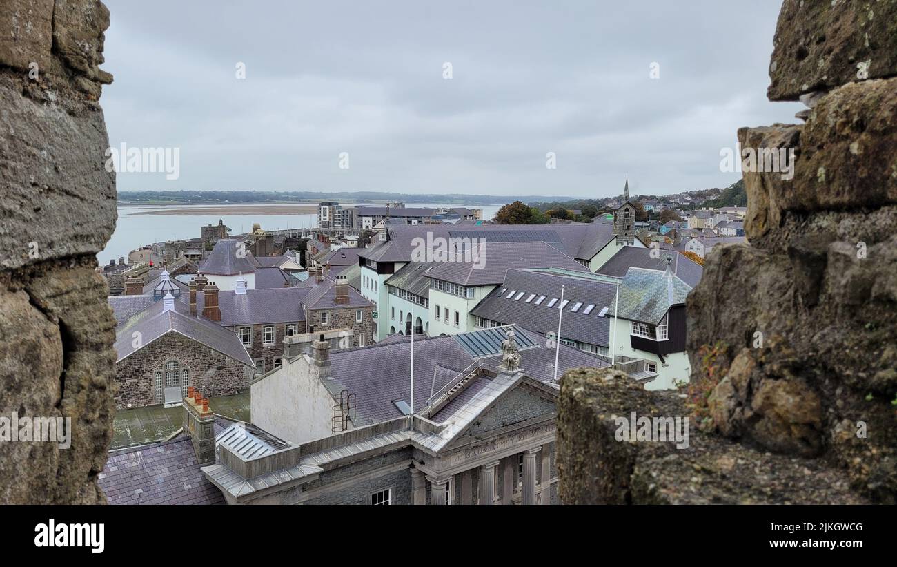A beautiful shot of the roofs of houses in Caernarfon under gray cloudy