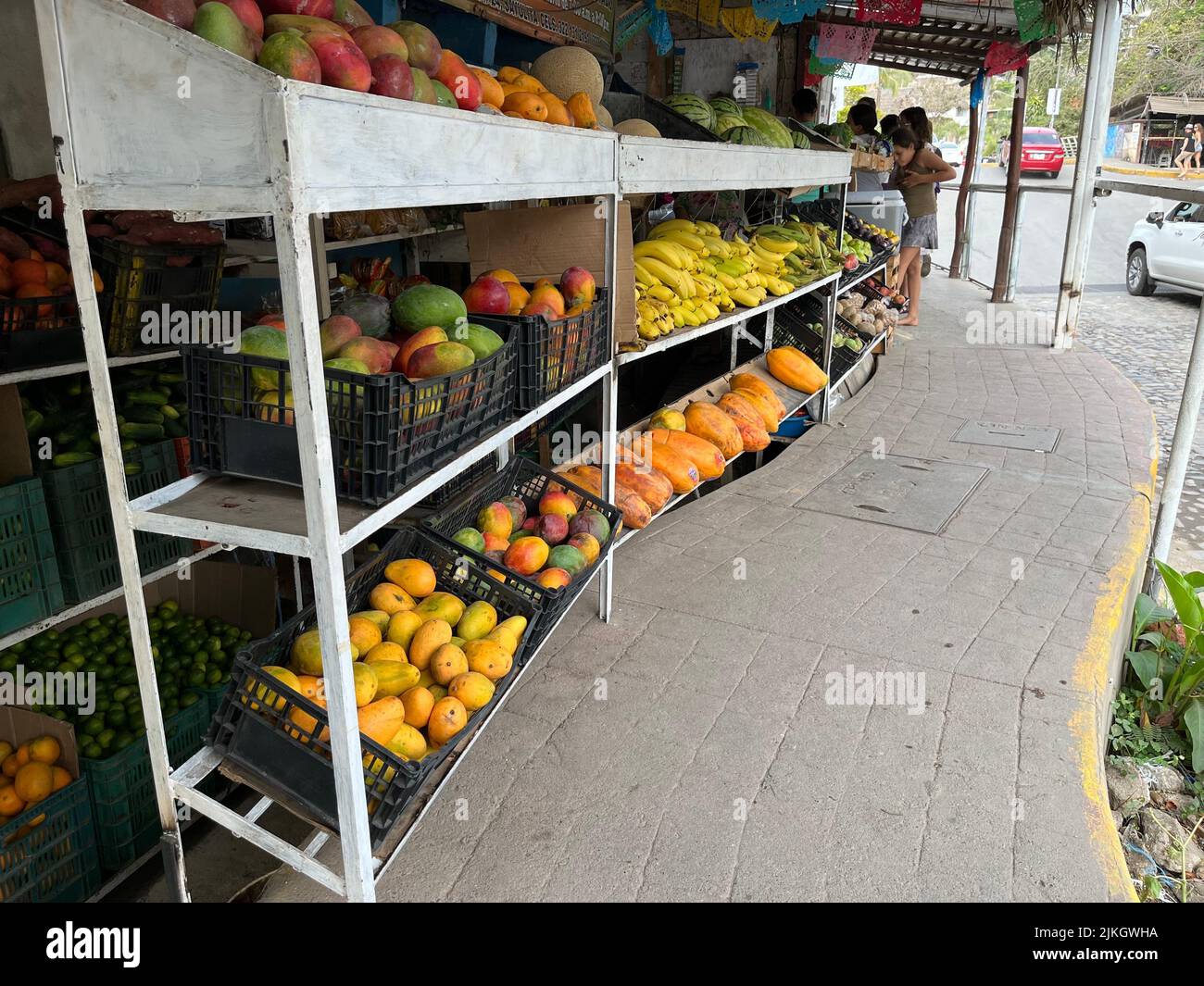 A fruit stand in Sayulita, Mexico, along the curb. Fully stocked with produce Stock Photo