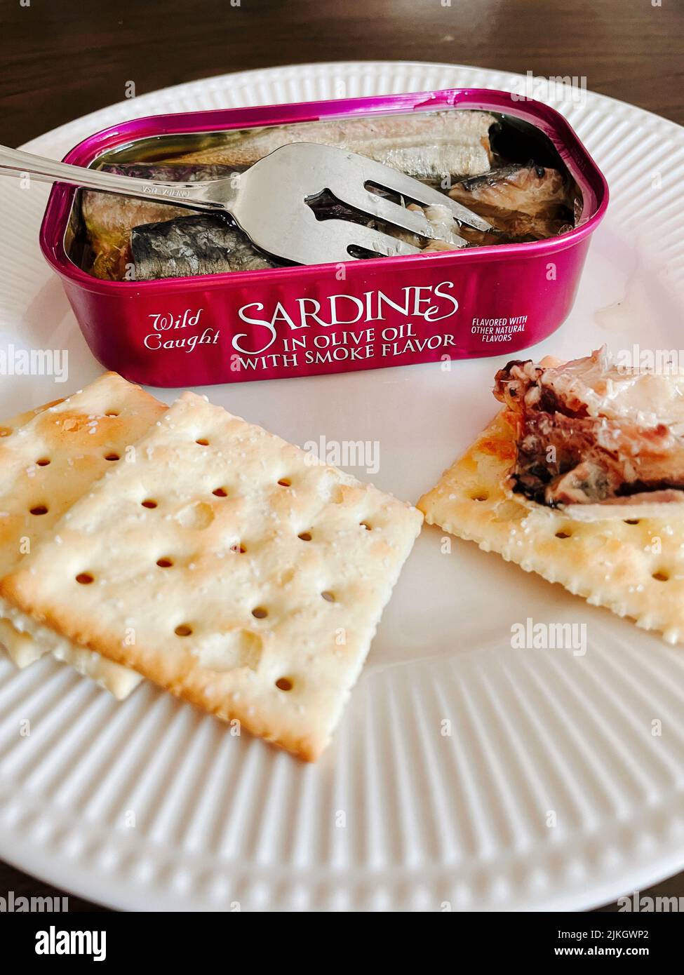 Open tin of sardines with saltine crackers 2022 Stock Photo Alamy