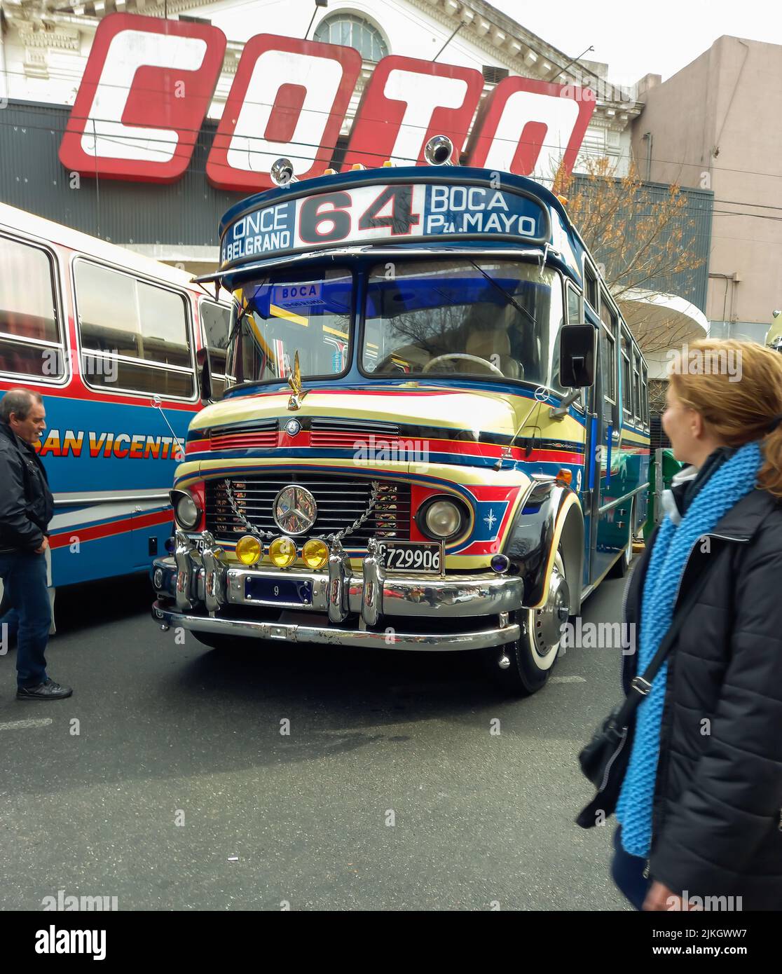People admire an old classic Mercedes Benz 1114 bus 1965-1974. Public passenger transport in Buenos Aires. Traditional fileteado ornaments Stock Photo