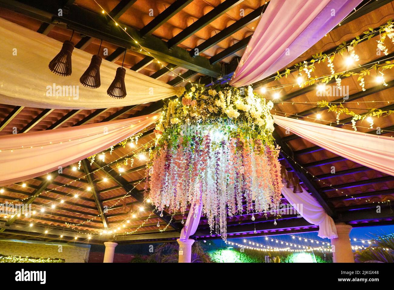 A crystal light fixture at a wedding reception Stock Photo