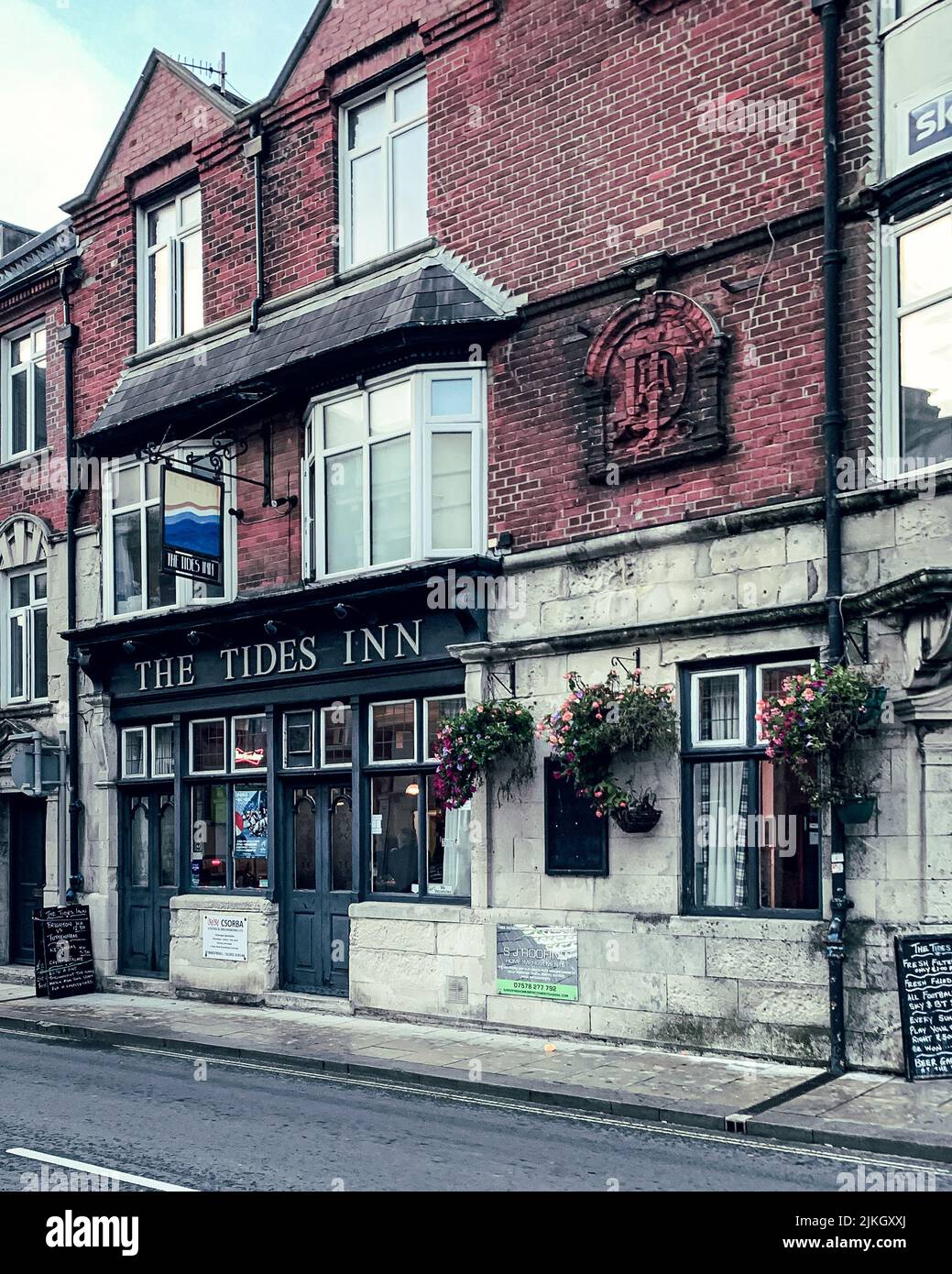 A vertical shot of the entrance of a pub near the seafront in Weymouth Stock Photo Alamy