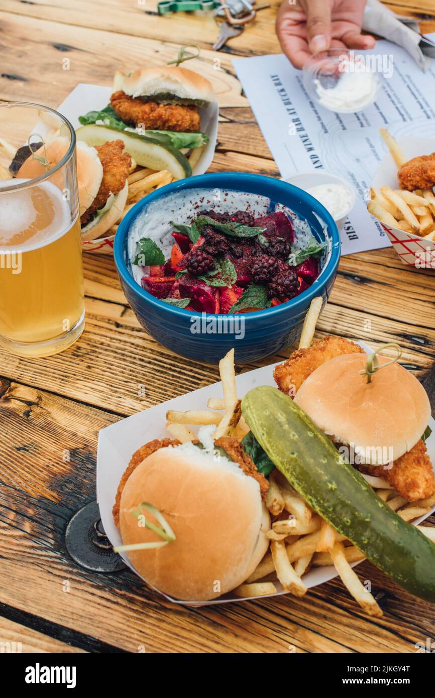 table spread meal at brewery of sliders sandwiches, French fries