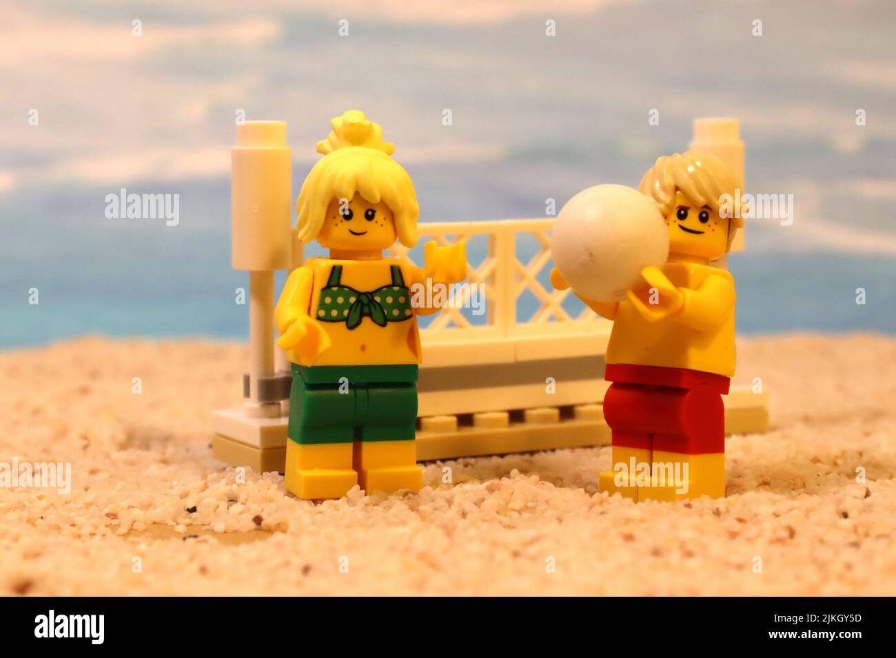 Beach volleyball with toy characters, figures playing together Stock Photo Alamy