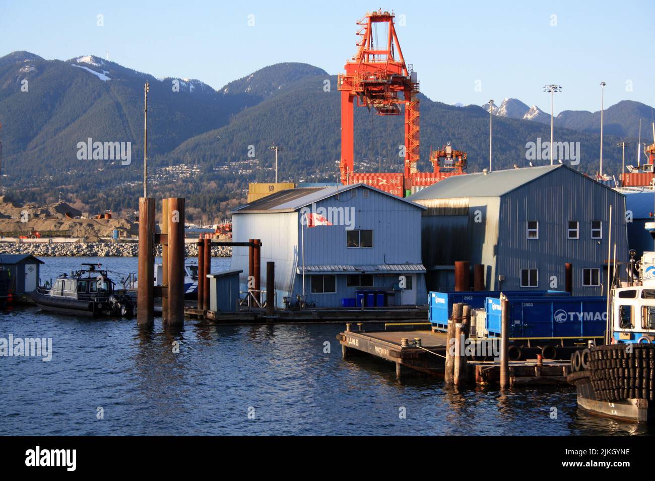 The Cranes, containers, boats and warehouses in the Port of Vancouver