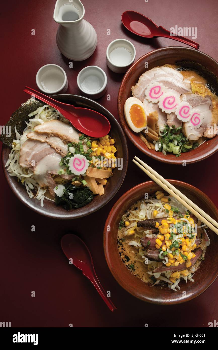 A top view of the Japanese ramen noodle soup on a red table Stock Photo