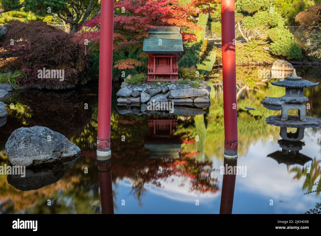 Reflection in Japanese Garden Pond of Red Pagoda and Torii Gate in Point Defiance Park, Tacoma, WA Stock Photo
