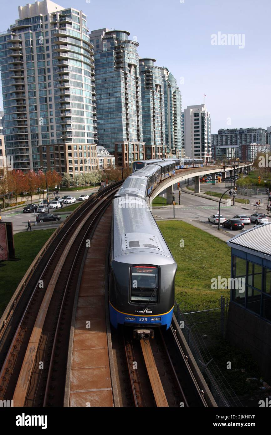 A vertical shot of a Sky Train entering downtown Vancouver, British Columbia, Canada Stock Photo