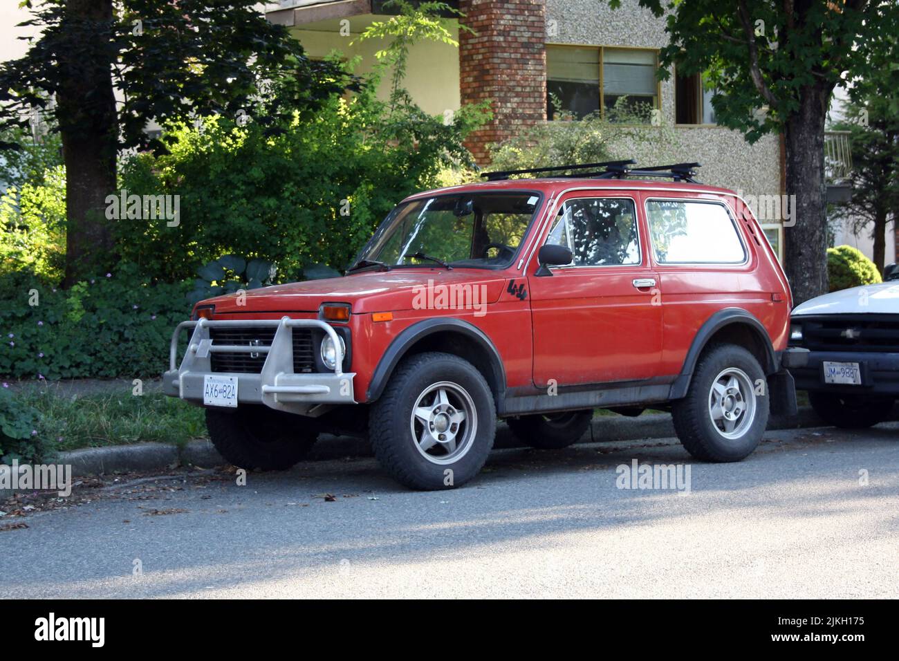 a vintage red Russian Lada car in the street of East Vancouver, British Columbia, Canada Stock Photo