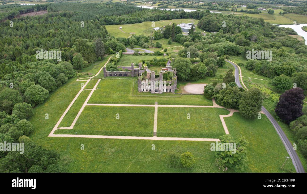 An aerial view of Saunderson castle surrounded by growing lush trees and greenery fields Stock Photo
