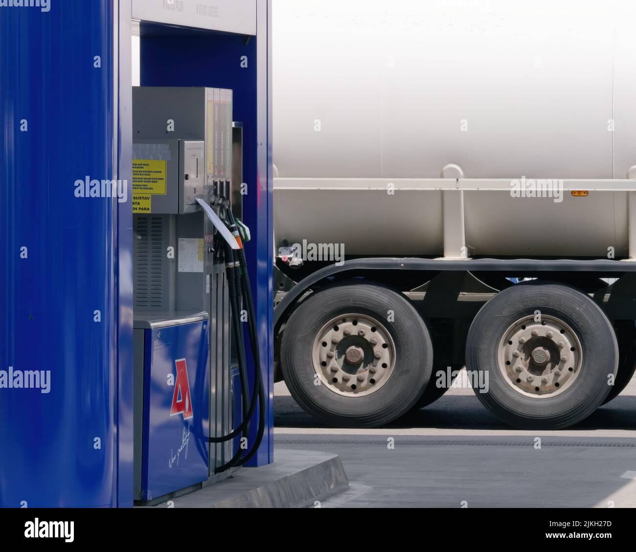 A view of an empty petrol station with the cistern in the background