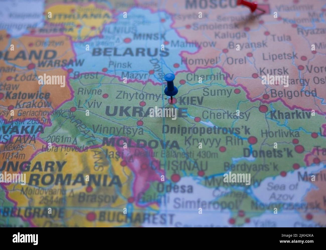 The capital city of Ukraine, Kiev, pinned on the map of Europe with a blue pin Stock Photo