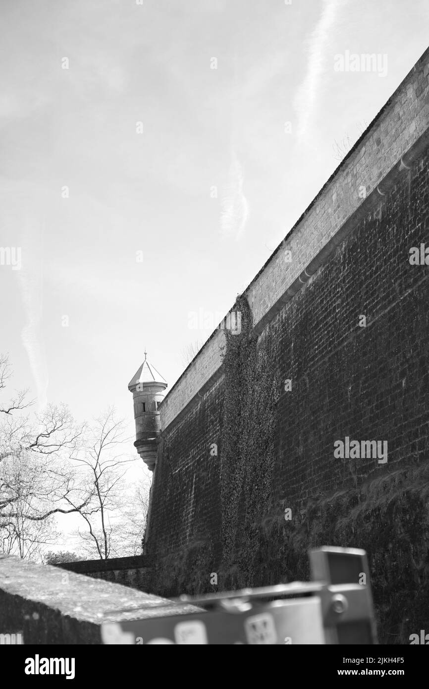 A grayscale vertical shot of the Mudam Modern Art Museum in Luxembourg Stock Photo