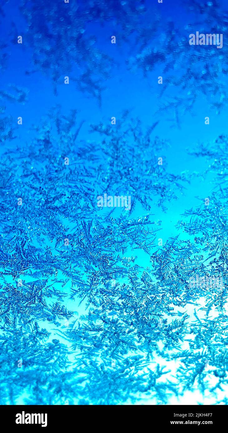 A vertical shot of a beautiful blue frozen background Stock Photo
