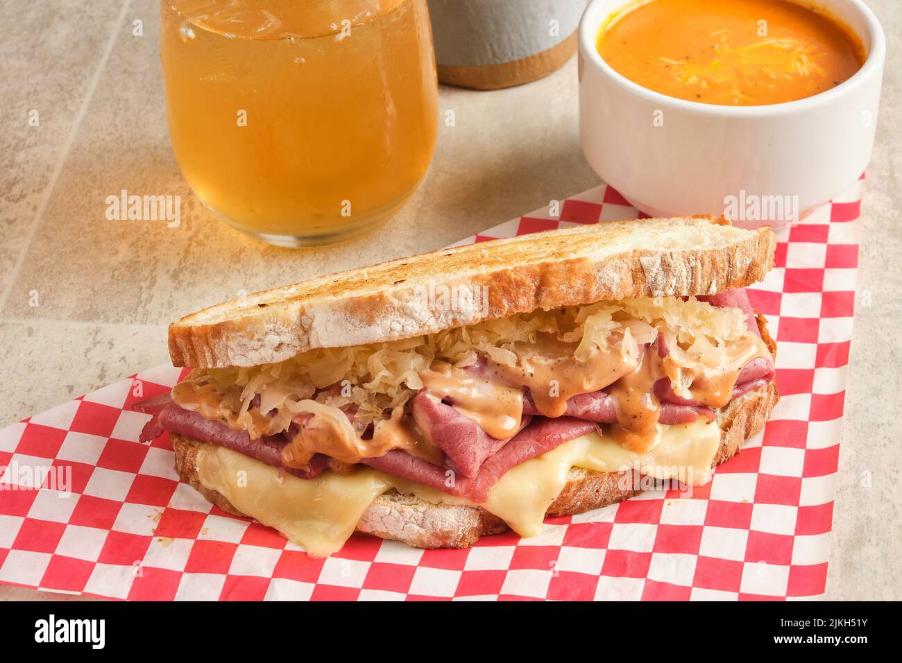 A fresh ham and sauerkraut sandwich with juice and sauce Stock Photo
