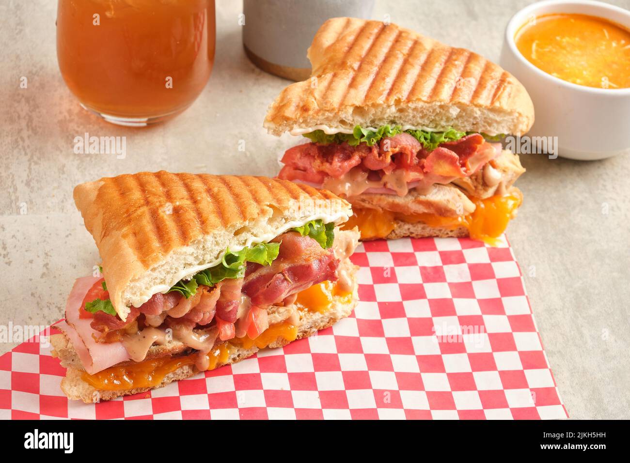 A freshly made ham, cheese, bacon panini Stock Photo