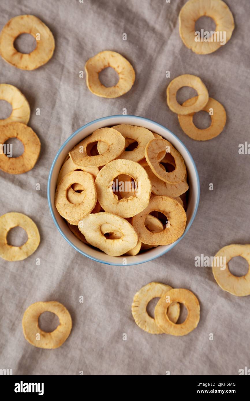 Homemade apple chips in a bowl, top view. Flat lay, overhead, from above. Stock Photo