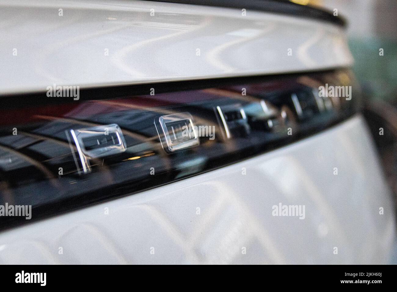 The Porsche Cayenne's emblem on the rear bumper Stock Photo Alamy