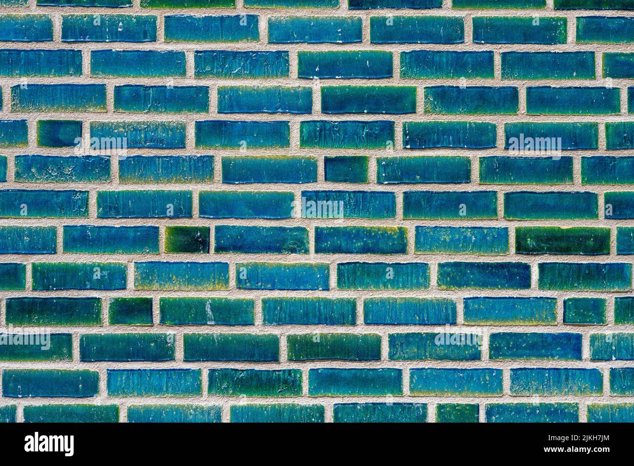 Background from a wall made of turquoise bricks Stock Photo