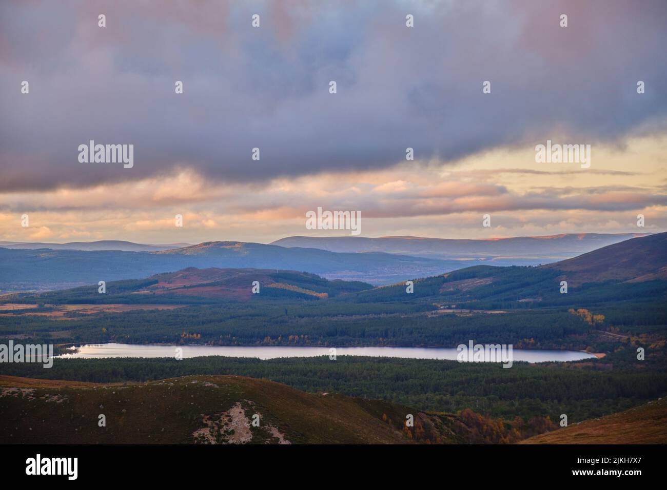 a beautiful view of a mountain river under overcast sky at sunset in Scotland Stock Photo